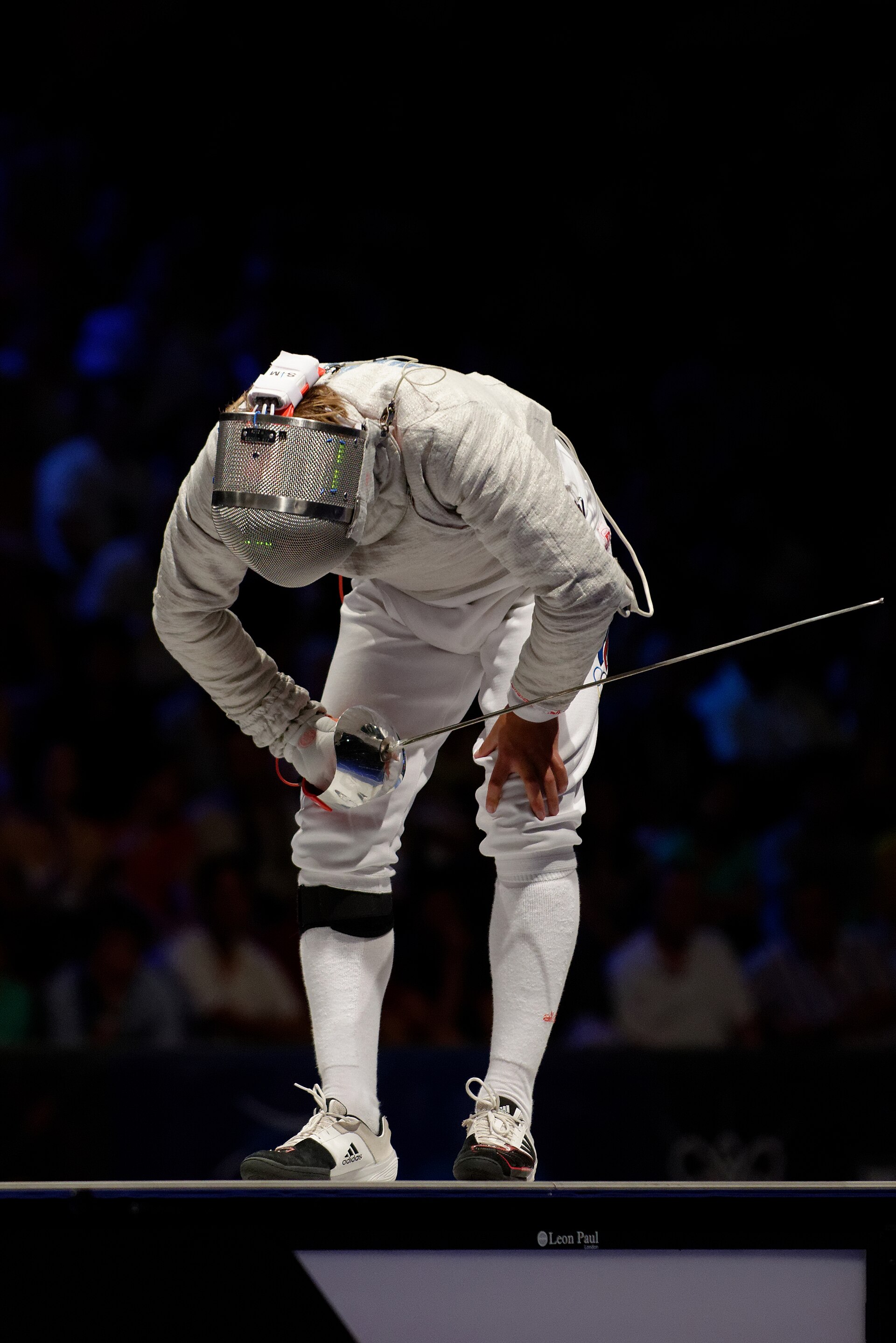 A fencer competing in a foil bout
